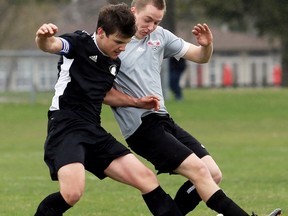 McGregor Panthers' Patrick Wilcox, left, battles North Lambton Eagles' Ryan Vandenberk during the second half of an LKSSAA senior boys' soccer game at John McGregor Secondary School in Chatham, Ont., on Tuesday, April 24, 2018. Mark Malone/Chatham Daily News/Postmedia Network