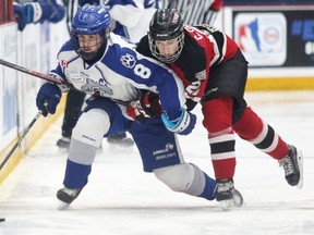 Joel Mongeon of the Sudbury Nickel Capital Wolves battles for the puck with Cole Cormier of the Moncton Flyers during 2018 Telus Cup action in Sudbury, Ont. on Wednesday April 25, 2018. Gino Donato/Sudbury Star/Postmedia Network