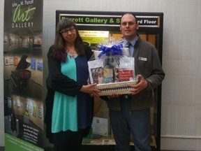 Submitted photo
Local poet and writer Karen Dack and Belleville library CEO Trevor Pross display the gift basket Dack will be presenting to one lucky winner next month. Dack will be at the library on May 5 raising funds and awareness for local mental health services.