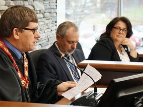 Luke Hendry/The INtelligencer
Hastings County Warden Rodney Cooney, left, addresses county council Thursday in Belleville. With him were chief administrative officer Jim Pine and deputy clerk Cathy Bradley.