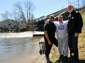 John Smith of Thorold joins Dean Wells and Port Dover Coun. John Wells at Misner Dam in Port Dover on Thursday. A request for proposal for repairs to the dam was issued this week with work to begin as early as July. JACOB ROBINSON/Simcoe Reformer