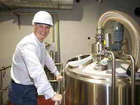 Brian Semkowski, president of Equals Brewery Co. Inc., shows off some of the firm’s fermentation hardware at its new facility on Sovereign Road in London. “The craft brewers see their brands growing but they don’t have the capacity . . . to meet demand,” he said. (Mike Hensen // Postmedia News)