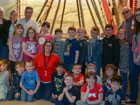 Teacher Jayne Morgan poses with her Grade 2 class from Ralph McCall as well as museum docents and volunteers on Fri., April 20. The students spent a week studying at Nose Creek Valley Museum.