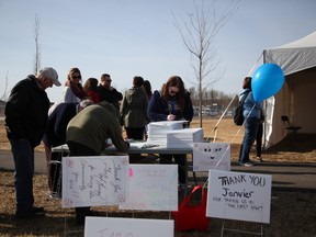 Hand-written 'thank you' signs littered the grass at Snye Point Park the morning of May 3, 2017, as dozens of residents were given the chance to express their gratitude on the anniversary of Fort McMurray's evacuation. Olivia Condon/ Fort McMurray Today/ Postmedia Network