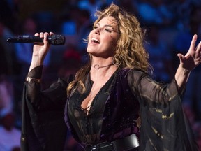 Shania Twain is seen here performing at the opening night ceremony of the U.S. Open tennis tournament at the USTA Billie Jean King National Tennis Center on Monday, Aug. 28, 2017, in New York. Twain has revealed in a recent interview with a British newspaper that she was sexually abused as a child by her stepfather.