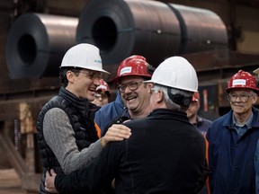 Prime Minister Justin Trudeau meets with workers during a tour of the Direct Strip Production Complex at Essar Steel Algoma on March 14. (THE CANADIAN PRESS)