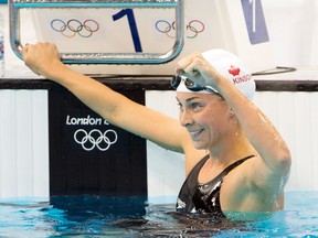 Stratford's Julia Wilkinson reacts after swimming to a third-place finish in the women's 100-metre freestyle heats at the 2012 Summer Olympics. THE CANADIAN PRESS/Ryan Remiorz