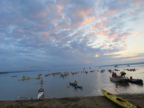 Participants paddled at dawn at Sandy Beach in Neyaashiinigmiing – one of the paddling stages of the Subaru Bruce Peninsula Multisport Race – at the August 12, 2017 race. Photo by CTRE Productions