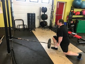 Farr Ramsahoye/Visionary Fitness 
Jan Murphy performs a reverse lunge, land mine, and slider combination under the guidance of his trainer Farr Ramsahoye, which reinforces optimal foot, knee, and hip mechanics, while building strong and functional legs.