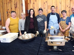 From left to right : Janet Boot, Janice Andrews,  Kerry Townsend, Scott Townsend, Kirk Berard, Debbie Chartrand and Tuckersmith Coun. Ray Chartrand on hand volunteering their time dishing out the meals for the fourth annual chicken dinner at the Vanastra Recreation Centre April 20.
(Shaun Gregory/Huron Expositor)
