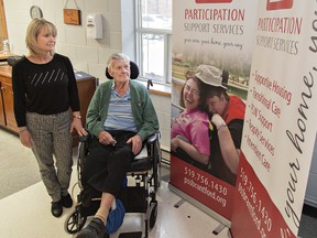 Participation Support Services executive director Sherry Kerr and client Allan Prior look at banners promoting the rebranding of the facility, formerly known as Participation House. (Brian Thompson/The Expositor)