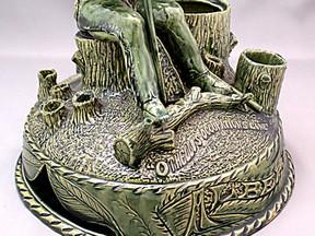 This exceptional clay presentation sculpture shows the seated Indian leaning on his lacrosse stick. At his feet is the phrase "Othello’s Occupation Gone" and below that is the word "Albert." On the lid that covered the largest hollow stump which held tobacco is inscribed the name of the potter, "T. O’Brien." He created the sculpture at the Brantford Stoneware Mfg. Co. in 1904. (Courtesy Brant Museum and Archives)