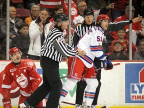 Soo Greyhounds Taylor Raddysh squawks as Kitchener Rangers Michael Vukojevic heads to the penalty box during the first period of Game 5 of the Ontario Hockey League Western Conference championship series at Essar Centre on Friday.