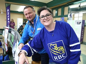 Faith Salmaso, community manager of RBC, with volunteer Joe McColeman at the Telus Cup at the Sudbury Community Arena in Sudbury, Ont. on Friday April 27, 2018. John Lappa/Sudbury Star/Postmedia Network