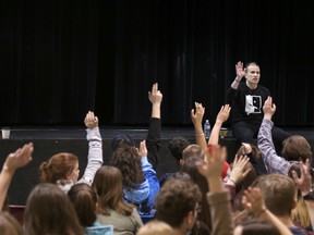 Michael Landsberg surveys his audience of Grade 11 and 12 students at St. Mary's High School on Thursday morning. (Greg Cowan/The Sun Times/The Postmedia Network)