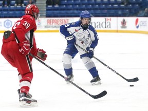 Joel Mongeon, right, of the Sudbury Nickel Capital Wolves, attempts to skate past Markus Paterson, of the Toronto Young Nationals, during Telus Cup action at the Sudbury Community Arena in Sudbury, Ont. on Friday April 27, 2018. John Lappa/Sudbury Star/Postmedia Network