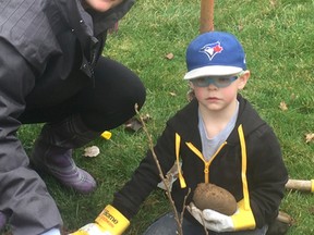 Vincent Ball/The Expositor
Jessica Kett of Jarvis and her four-year-old son, Ellis, were at Jacob's Woods Park in St. George on Saturday to participate in the Brant Community Tree planting event.