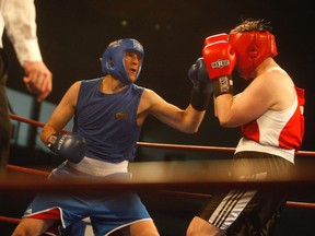 GORDON ANDERSON/DAILY HERALD-TRIBUNE 
Jeff Goulden (in blue) squares off against Gregory Melenka in the Fight For Hope boxing card at the Crosslink County Sportsplex on Saturday night. Goulden defeated his opponent by unanimous decision.