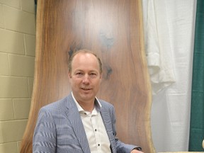 Wayne Datema, owner of Country Charm Mennonite Furniture of Rockford, with some of the live-edge pieces he had on display at the Owen Sound Home and Cottage Expo at the Harry Lumley Bayshore Community Centre on Saturday, April 28, 2018 in Owen Sound, Ont. Rob Gowan/The Owen Sound Sun Times/Postmedia Network