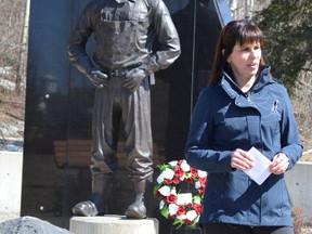 Janice Martell, head of the McIntyre Powder Project, speaks during Saturday's National Day of Mourning ceremony at the Schumacher Miners Memorial Park. This marked the first such event Martell experienced without her father, Jim Hobbs, who died last May. Hobbs was one of thousands of miners who inhaled aluminum dust before his shifts. Martell said more recognition for occupational disease is necessary.