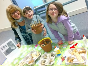 Bruce Botanical Food Garden's Ingrid Wypkema works with visitors Katie and Emily Hutter during the Seedy Saturday event at the Kincardine Library on April 21, 2018. The event was an educational opportunity on the importance of saving seeds, gardening and agriculture. (Shared photo from Lise Row)