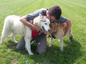 Myles Armstrong with dogs Kolbie and Slush.