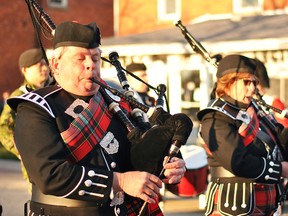 Bagpipers march in a parade to commemorate Victoria Cross recipient Cpl. Harry Garnet Bedford Miner, a Cedar Springs man who died in the First World War, outside of the Blenheim Legion Saturday evening. (Tom Morrison/Postmedia Network)