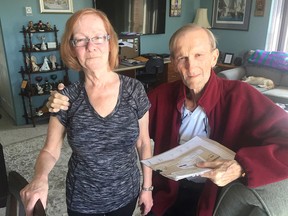 Norma and David Jackson, in their Kingston apartment on Monday, want to go on a honeymoon to the United Kingdom but can't go until Norma gets a Canadian passport but their application is being held up by the Passport Entitlement and Investigations Division. (Ian MacAlpine/The Whig-Standard)