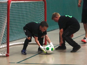 Gordon Anderson/Daily Herald Tribune
Sam Scott, left, and Tanner Dukkart from Eaglesham School participated in the soccer game against Grande Prairie firefighters in the 3D Charity Hockey and Soccer Tournament at the Eastlink Centre on Saturday afternoon.