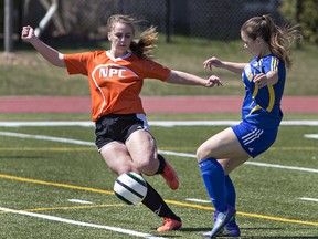 Erica Rohr of North Park Collegiate  beats Kayla Drassich of Brantford Collegiate Institute to the ball during a high school girls soccer match on Monday at Bisons Alumni North Park Sports Complex. (Brian Thompson/The Expositor)