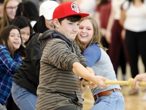 Kevin Hampson/Daily Herald-Tribune
Aidan Gellings, Faith Evans and other Grade 8 students take part in a tug-of-war during the first day of classes at St. John Paul II Catholic School on Monday.