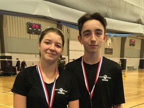 Pictured are Keeley Mitchell (left) and Braeden McNaughton (right) standing with their medals and rackets after their golden performance at WOSSA on April 11.