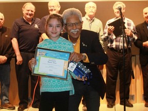 Kiwanis Eastern Canada and Caribbean District Governor Robert Moo Young gives P.E. McGibbon student Natalie Prior a Kiwanis Terrific Kids Award during a school assembly on April 26.
CARL HNATYSHYN/SARNIA THIS WEEK