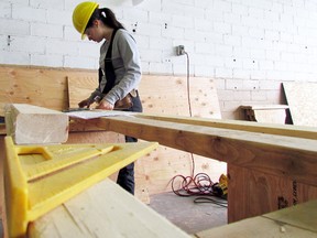 Christina Barone, a Grade 12 student at Superior Heights Collegiate and Vocational School, makes measurements during Algoma District School Board’s district skills competition for individual carpentry on March 28 at Canadian Bushplane Heritage Centre.