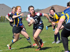 Holy Trinity's Daniella Michaud turns upfield during NSSAA rugby action vs. the Delhi Raiders Monday in Simcoe. Michaud scored three tries as Holy Trinity downed DDSS 53-10.
JACOB ROBINSON/Simcoe Reformer