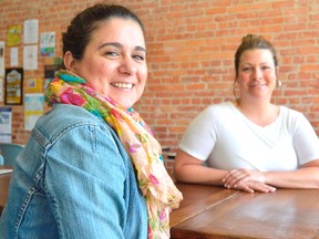 One year in Maria Fiallos, left, and Stacey Hayhoe are still grappling with the success of Streamliners Espresso Bar, a coffeehouse they opened in May 2017. This weekend they're hosting their one-year anniversary with live music and a line of new summer drinks. (Louis Pin/Times-Journal)