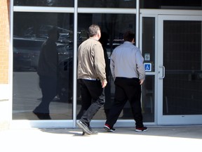 Josh Alexander, right, enters the provincial courthouse on Tuesday, May 1, 2018 in Stratford, Ont. Terry Bridge/Stratford Beacon Herald/Postmedia Network