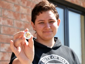 Alex McEwin, 19, will speak about living with multiple sclerosis at this Sunday’s Mandarin MS Walk at Stratford Central Secondary School. Pictured, McEwin holds one of the buttons he made for his fundraising team, Team Valor. Galen Simmons/The Beacon Herald/Postmedia Network