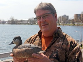 John McCafferty is seen with his hand-sculpted, hand-painted ring neck duck decoy. The art piece won two firsts and a second in Advanced Decorative Life-size Floating Waterfowl competitions at the Ward World Championship Wildfowl Carving Competition in Ocean City, Md. (Steph Crosier/The Whig-Standard)