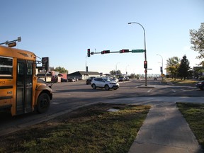 A school bus sits at the light on the corner of Silin Forest Road and Thickwood Blvd. as McMurray's students head back to classes on the first day of a new school year, September 6, 2016. Olivia Condon/ Fort McMurray Today/ Postmedia Network