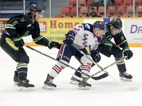 Forward Austin Stauffer, of the Cochrane Crunch, cuts between a pair of Thunder Bay North Stars — Justin Muir, left, and Cole Turbide — as he attempts to take the puck to the net during the opening day of the Dudley Hewitt Cup at the Dryden Memorial Arena on Tuesday. The North Stars, the second rep of the SIJHL, went on the defeat the NOJHL champion Crunch 4-0. The Crunch will return to action on Wednesday when they tangle with the host Dryden Ice Dogs, champions of the SIJHL.  TIM BATES, DHC/OJHL IMAGES