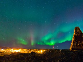Northern lights fill the sky over monument hill in Fort Chipewyan, Alta. on September 13, 2013. Established in 1788, Fort Chipewyan is the oldest settlement in Alberta. Ryan Jackson/Postmedia Network