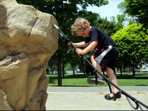 A four-year-old child plays in a park in this file photograph. Column Karen Robinet remembers a time when children were not only encouraged to run wild, but were expected to. File photo/Postmedia Network