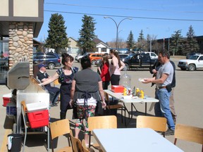 West Side Community Church was serving barbecued hot dogs April 26 at Freson Bros in Fairview.