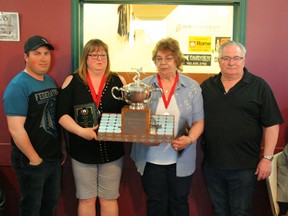 The Roy Stirling Memorial Trophy is presented each year to the person or persons who have done the most to contribute to the sport of Five-Pin Bowling in Fairview. This year, the trophy is shared between Lori Grinde and Chris Potrebenko for all the work they've done behind the scenes. Jordon Stirling (far left) and Dwayne Stirling presented the trophy.