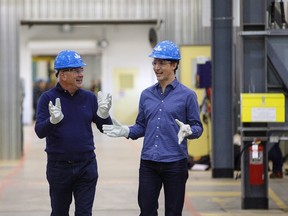 Prime Minister Justin Trudeau and Suncor CEO Steve Williams, left, tour Suncor's Fort Hills facility near Fort McMurray, Alta., on Friday, April 6, 2018. THE CANADIAN PRESS/Jason Franson