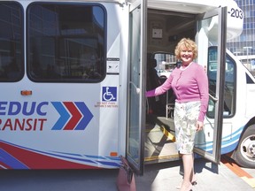Partners of the Airport Accord gathered outside the Edmonton International Airport on April 26 to announce the enhanced transit connections between the airport and its regional neighbours. Above: Leduc County mayor Tanni Doblanko poses next to a Leduc Transit bus. New routes have been added to accommodate travel to and from the Premium Outlet Collection.