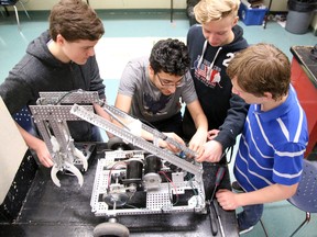 Tim Miller/The INtelligencer
The Bayside Secondary School robotics team looks over one of their creations on Thursday.  The team will be competing for the first time at the Skills Ontario Competition next week. Pictured (from left) are Malcolm Campbell, Karim Shekh-Yusef, Garrison Moore and Paul Bunge.