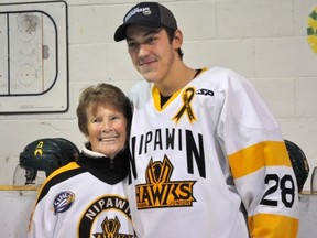 Josh McDougall is in the running for top defenceman of the year for the Canadian Junior Hockey League. He is pictured with his grandmother, from Prince Albert,  following the Hawks winning of the Canalta Cup last week.