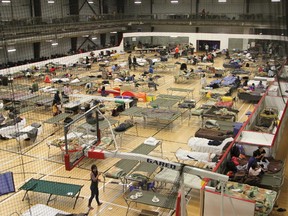 Cots are set up in the fieldhouse of the Anzac Recreation Centre in Anzac Alta. on Wednesday May 4, 2016. Robert Murray/Fort McMurray Today/Postmedia Network